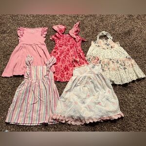 Set of Girls' Dresses in Pink and Floral Patterns